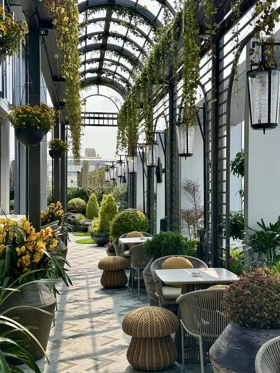 Plant-filled rooftop terrace and seating at Andaz Shanghai ITC